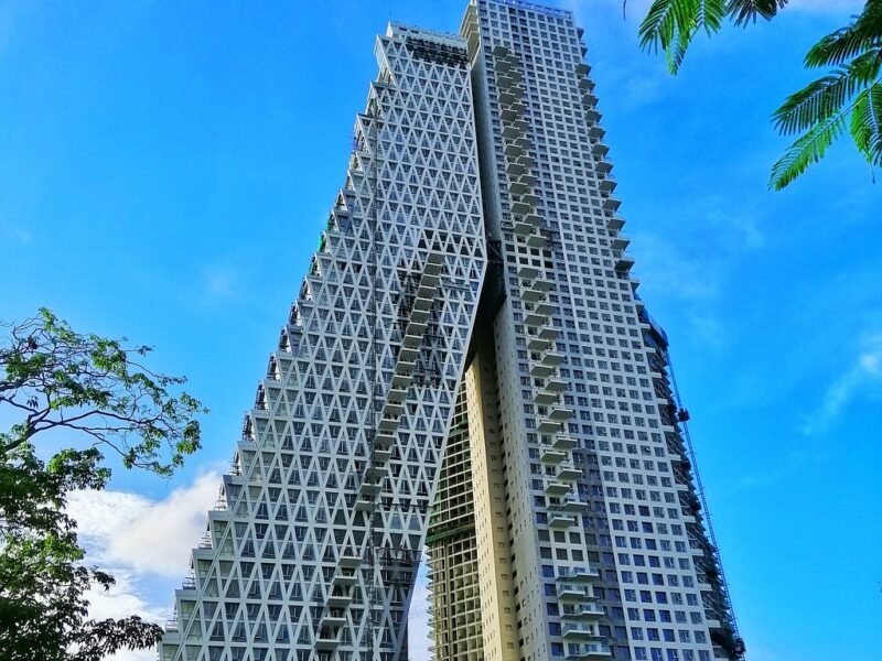 Residential tower against blue sky